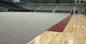 CourtCover carpeted gym floor cover being installed.